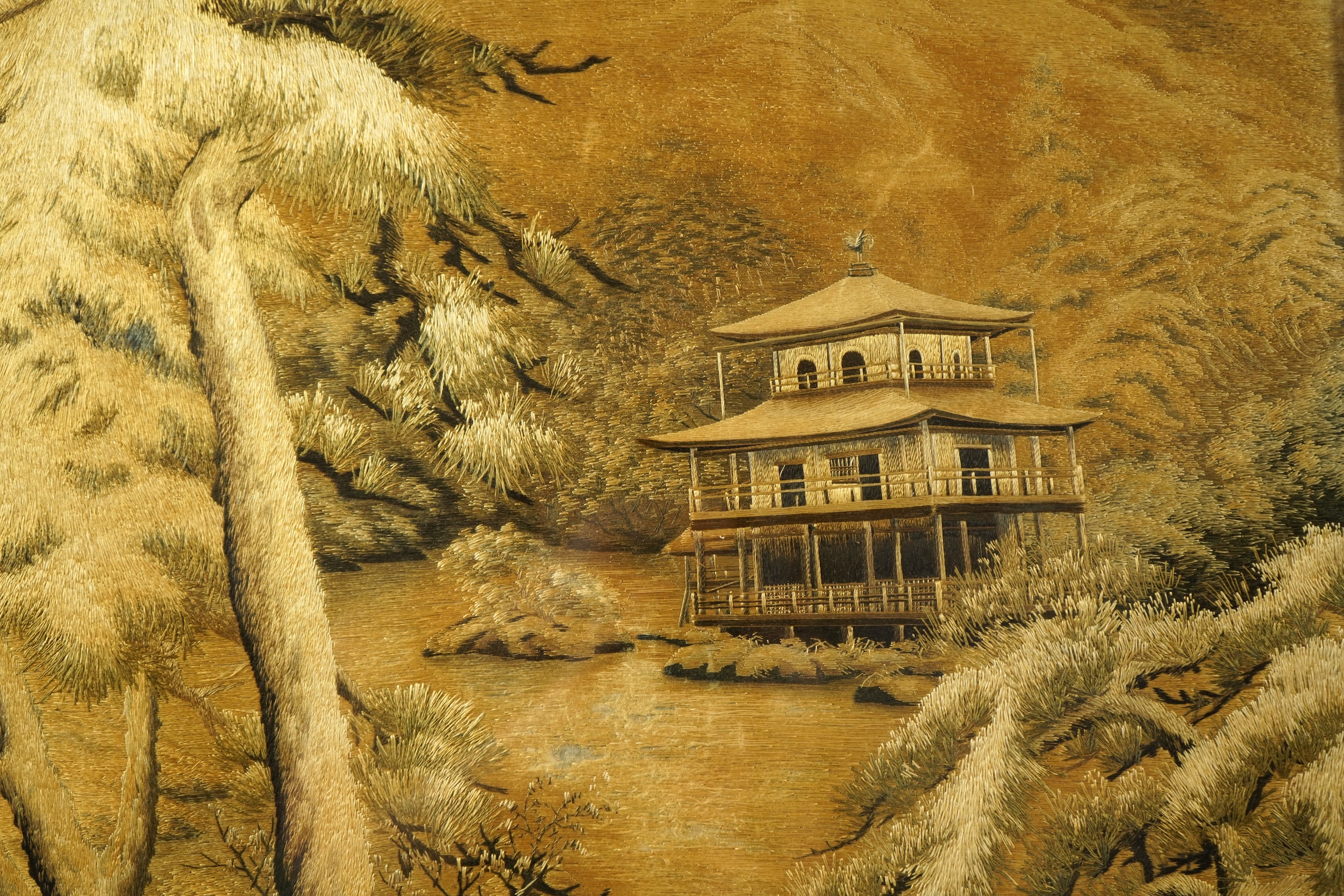 A Japanese embroidered silk picture of Kinkaku-ji, 'Temple of the Golden Pavilion' in Kyoto, Meiji period (1868-1912)